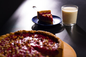 Piece of pie on plate. Milk with cake. Breakfast with milk and bakery.