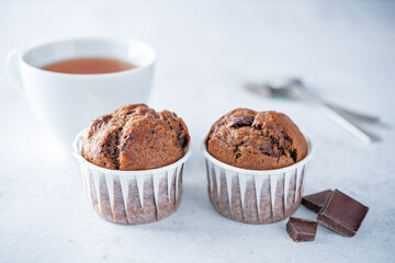 Sweet fresh chocolate muffins with chocolate slices