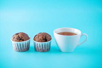 Sweet fresh chocolate muffins with chocolate slices