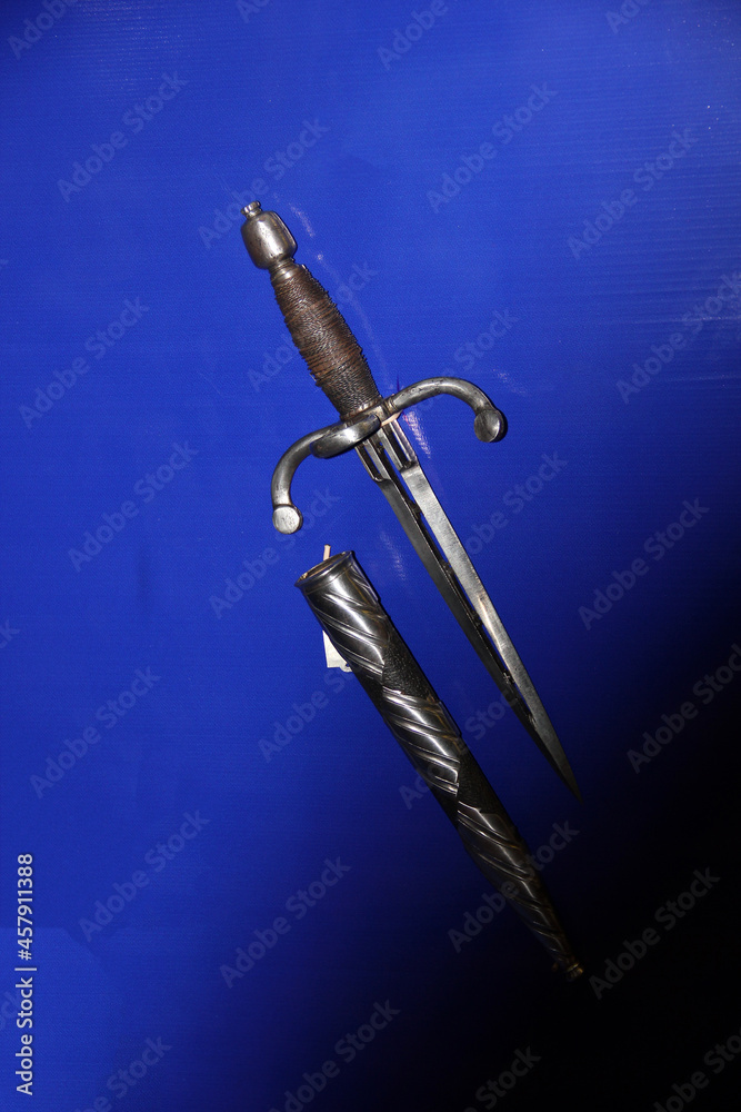 Canvas Prints Medieval dagger on blue background