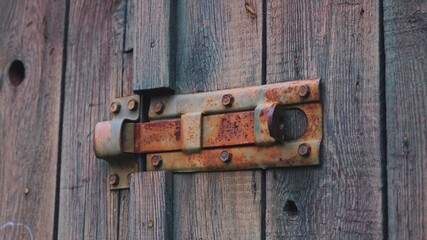 Old Wooden Barn Garage Doors Closed with Metal Rusty Latch