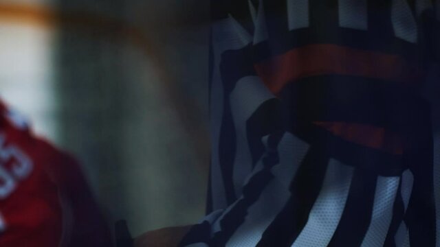 Close-up of referee during professional hockey match. Ref looking at situation, skating while game stopped. Concept of ice, sport, competition.