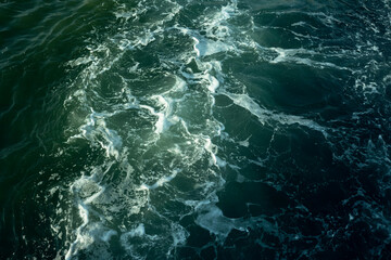 The texture of the surface of blue Sea water.