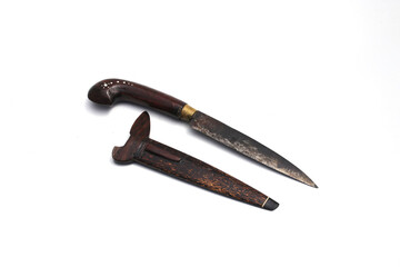 Old used Indonesian Knife with handle and knife scabbard made from wooden isolated on white background
