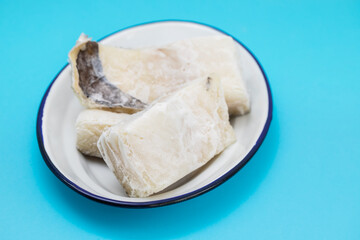 frozen cod fish on white dish