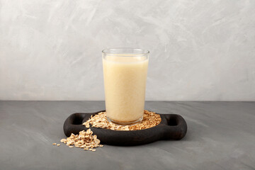 Oat milk - fresh organic and vegetarian non dairy alternative drink. Vegan oat  milk in a tall glass