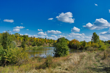 Autumn landscape with lake and trees, lake in the forest