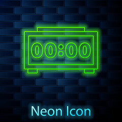 Obraz premium Glowing neon line Digital alarm clock icon isolated on brick wall background. Electronic watch alarm clock. Time icon. Vector