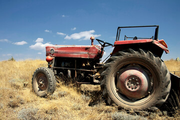 old tractor broken down and stuck in the field