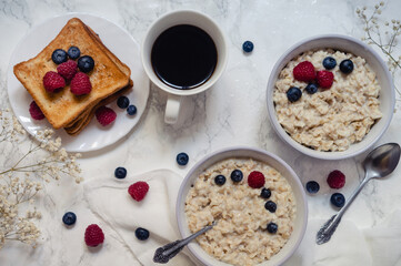 oatmeal porridge with milk, cereals, toast, coffee for breakfast