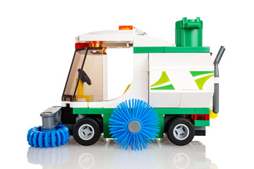 Fototapeta premium toy constructor made of parts for assembling a city cleaning machine, children's toy constructor, isolated on a white background