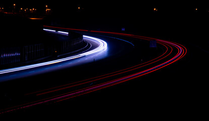 Night road lights. Lights of moving cars at night. long exposure red, blue, green