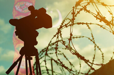 Double exposure - camera, barbed wire and flag Turkmenistan