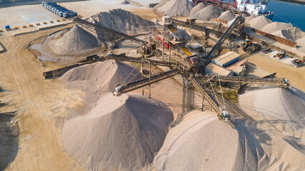 Aerial view of sand and grawel sorting pit by industrial estate.