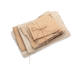 Tied pieces of cardboard on white background