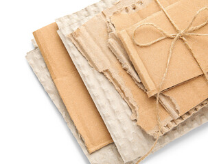 Tied pieces of cardboard on white background