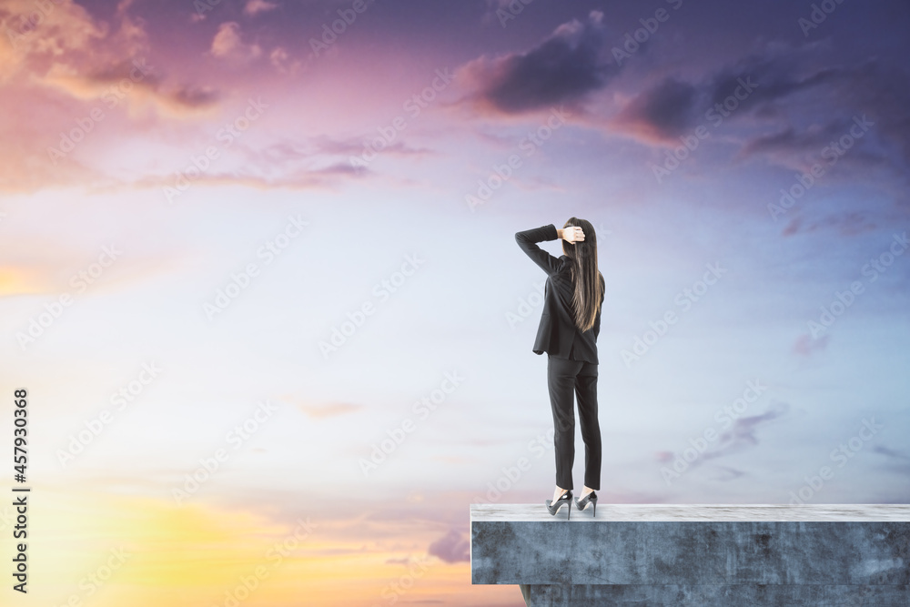 Poster female on abstract concrete edge looking into the distance on creative bright sky background with mo