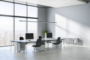 Modern concrete office interior with windows, city view, sunlight, equipment and furniture. 3D Rendering.