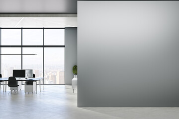Modern concrete office interior with blank mock up place on wall, windows, city view, sunlight, equipment and furniture. 3D Rendering.