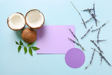 Fototapeta na wymiar Composition with blank cards, coconuts and lavender flowers on color background