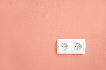 Electric socket on color wall