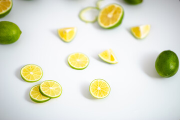 Closeup detail view green lime lemons over isolated white backdrop.Includes copy space.