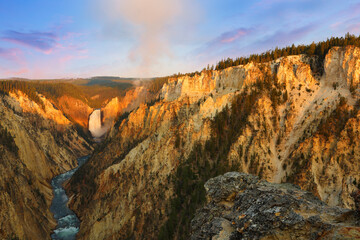Overlook beautiful sunrise of south rim of the Grand Canyon of the Yellowstone from Artist Point  in Yellowstone National Park, Wyoming USA.