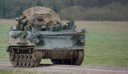 army armoured personnel carrier in action on a military exercise Wiltshire UK