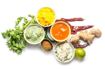 Traditional Indian food and spices on white background