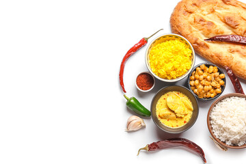 Traditional Indian food and spices on white background