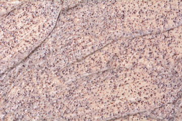 Clay face scrub texture. Microparticles in cosmetics. Sample of cosmetic products.