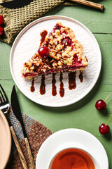 Composition with tasty cherry pie and cup of tea on color wooden background