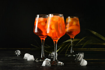 Glasses of tasty aperol spritz cocktail on table