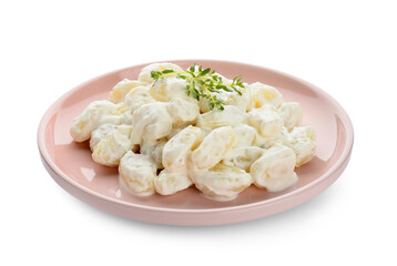 Plate of delicious gnocchi with creamy sauce on white background