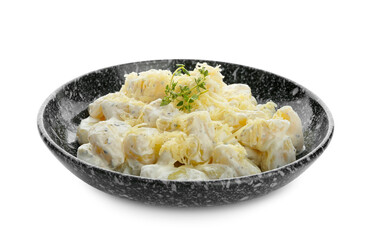 Bowl of delicious gnocchi with creamy sauce on white background