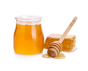 Jar of honey, comb and dipper on white background