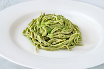 Green noodles with creamy sauce