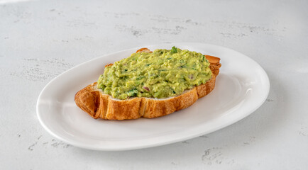 Croissant with guacamole