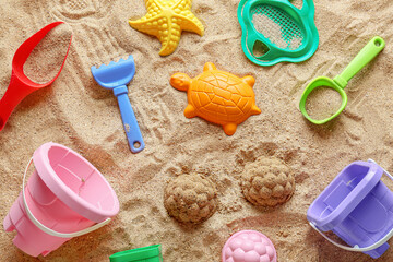 Fototapeta na wymiar Set of beach accessories for children on sand