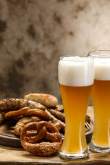 Glasses of cold beer and snacks on table. Oktoberfest celebration