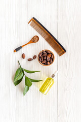 Hair treatment by cocoa oil with hair comb. Top view