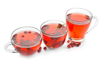 Cups of tasty tea with cranberry on white background