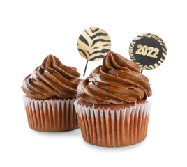 Tasty cupcakes for New Year 2022 celebration on white background