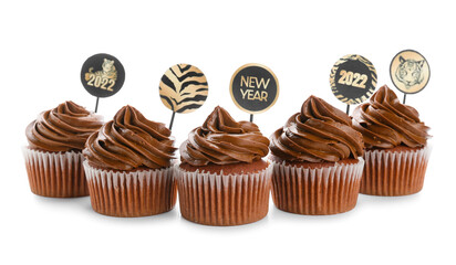 Tasty cupcakes for New Year 2022 celebration on white background