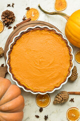 Composition with delicious pumpkin pie on white background