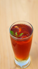 Ice tea with mint leaves in glass. Focus selected