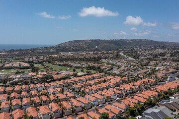 Aerial View of an upscale California oceanfront neighborhood, aerial view of golf course, ocean, and master planned community