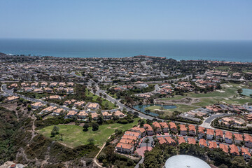 Aerial View of an upscale California oceanfront neighborhood, aerial view of golf course, ocean, and master planned community