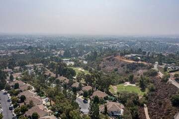 Aerial View of a Suburban California Community Near a Golf Course on a Foggy Day
