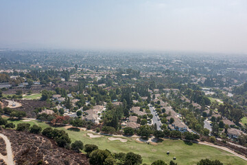 Aerial View of a Suburban California Community Near a Golf Course on a Foggy Day